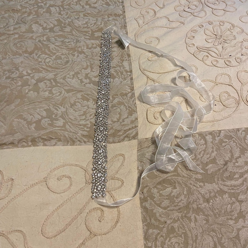Brand new wedding dress from David’s bridal size 4 color white